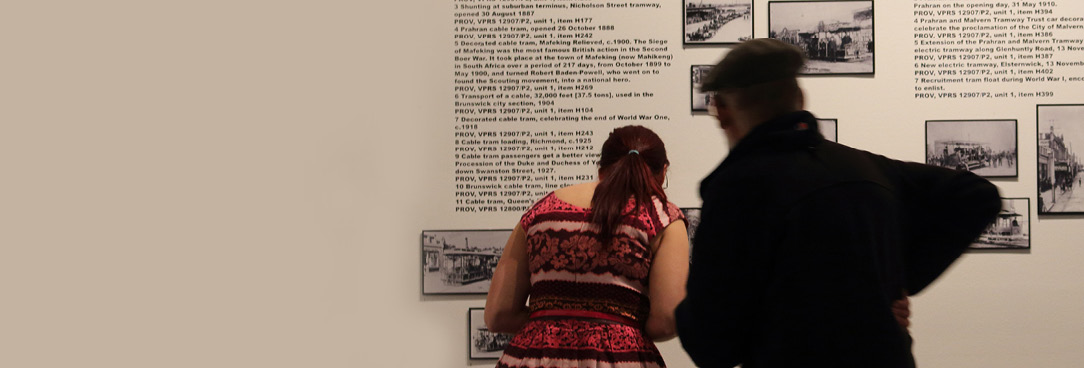 people looking at exhibition