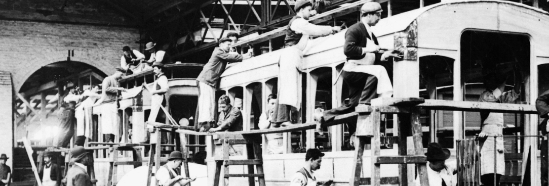Black and white photo of a tram being built