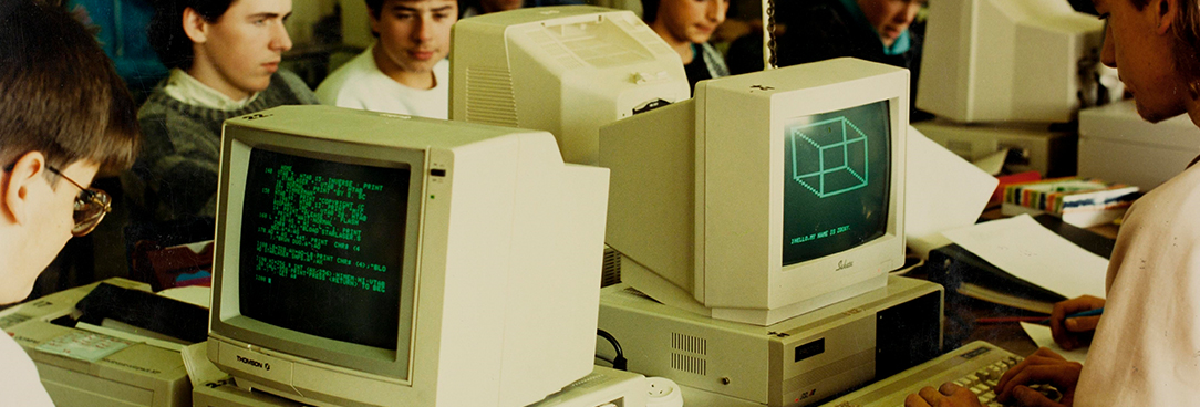 old fashioned computers being used by school children