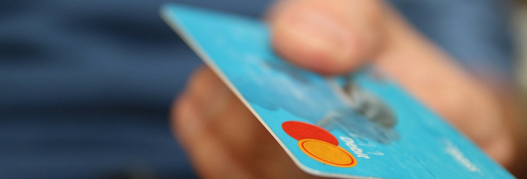 hand holding credit card