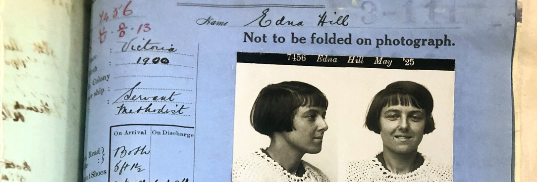 blue piece of paper with a photo of a young woman's face glued on top and name Edna Hill listed at the top of the page