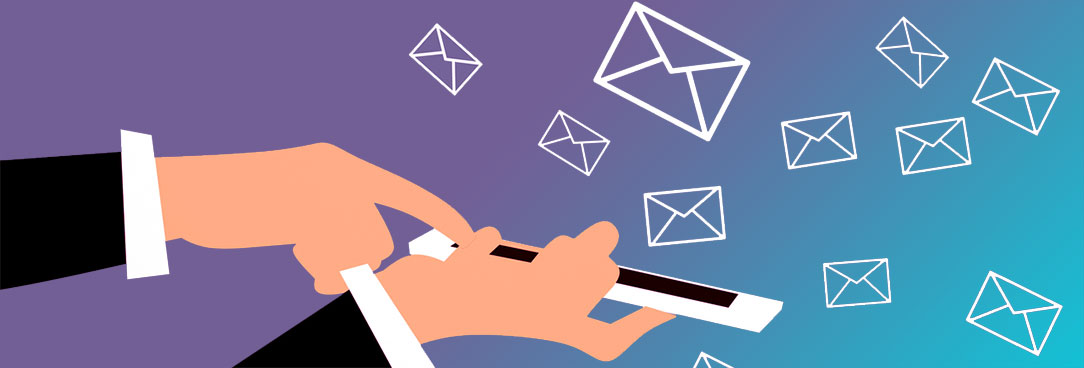hand holding phone and flying emails
