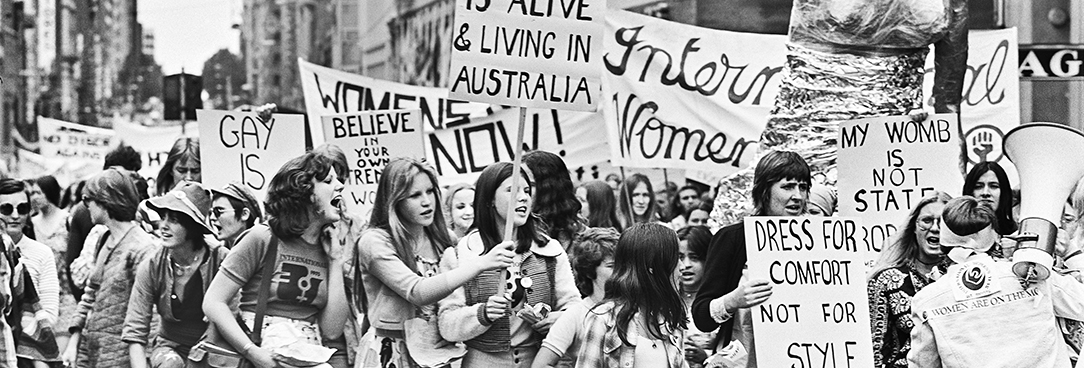 Black and white photo of a women's rights protest in 1975