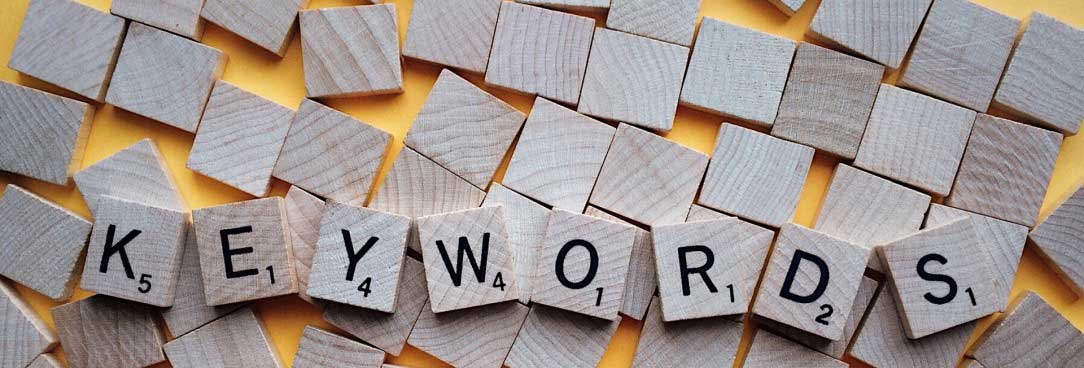scrabble pieces spelling keywords