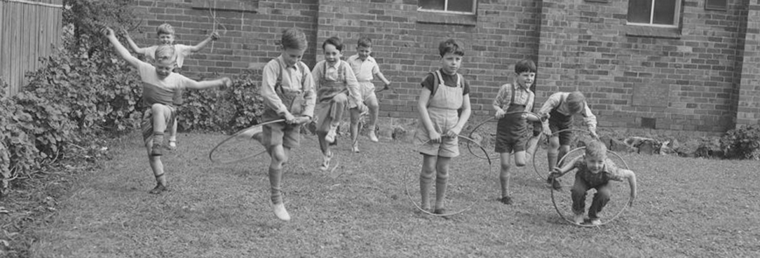 boys playing with hula hoops