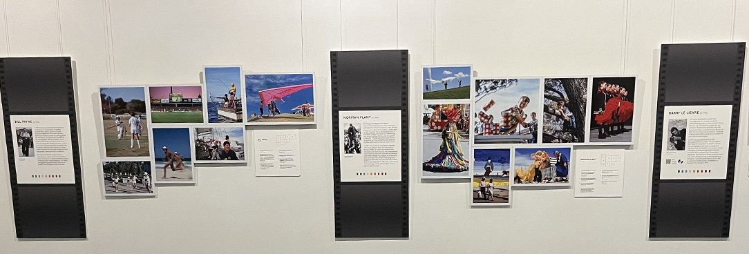 a photo of one of the walls of the exhibition featuring an array of photographs