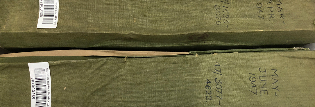 two large green books, one on top of the other