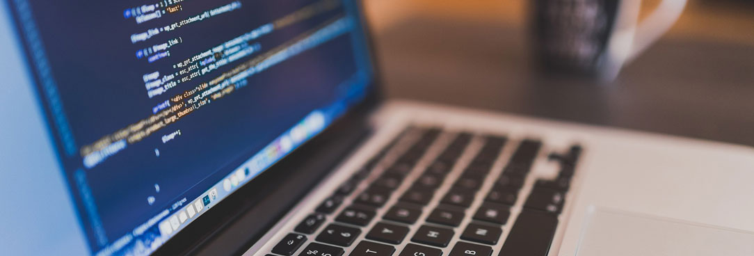 laptop with code on screen
