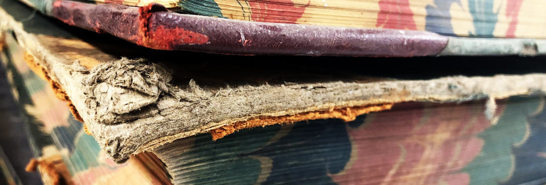 photo of books stacked on top of each other