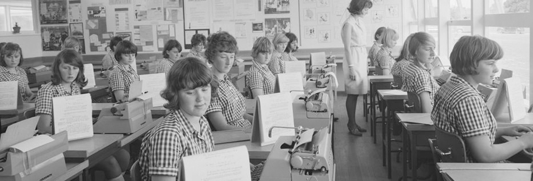a classroom of women writing