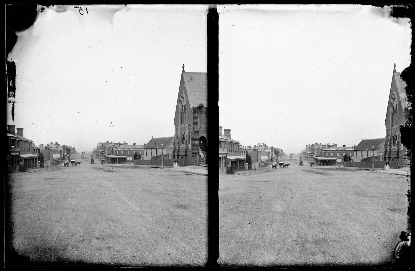 black and white photo of a street scape from the late 1800s