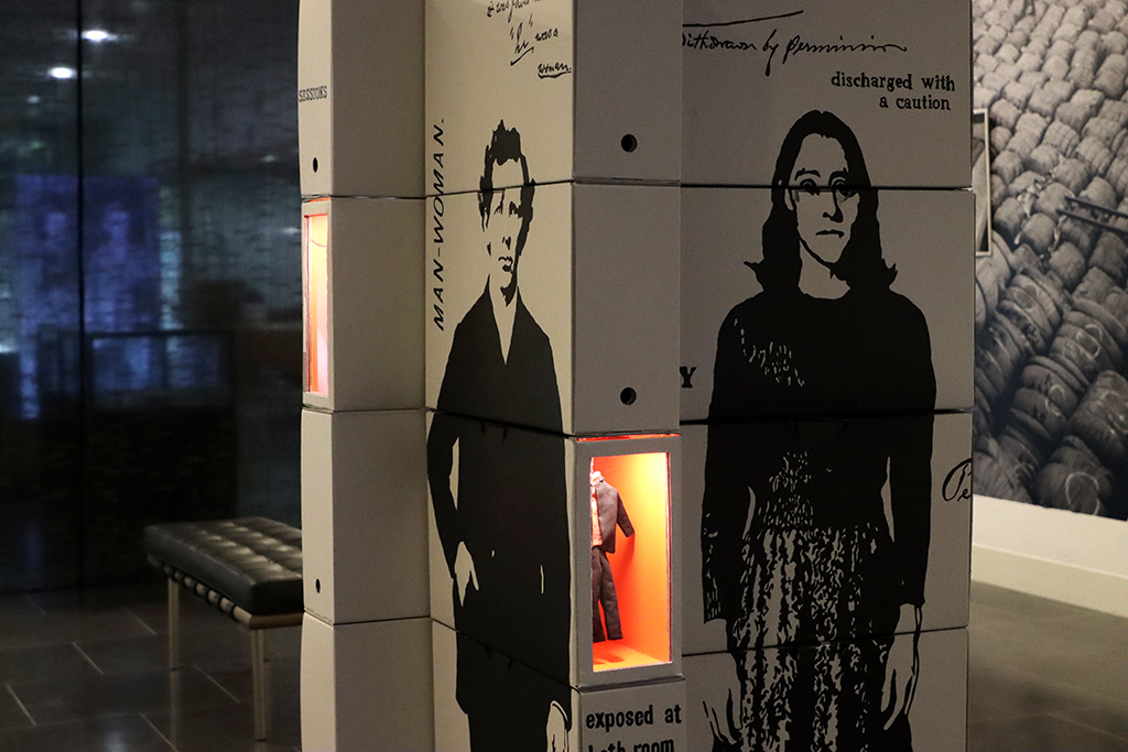 Rewind Forward exhibition. A sculpture made from boxes, painted with figures is in the foreground.