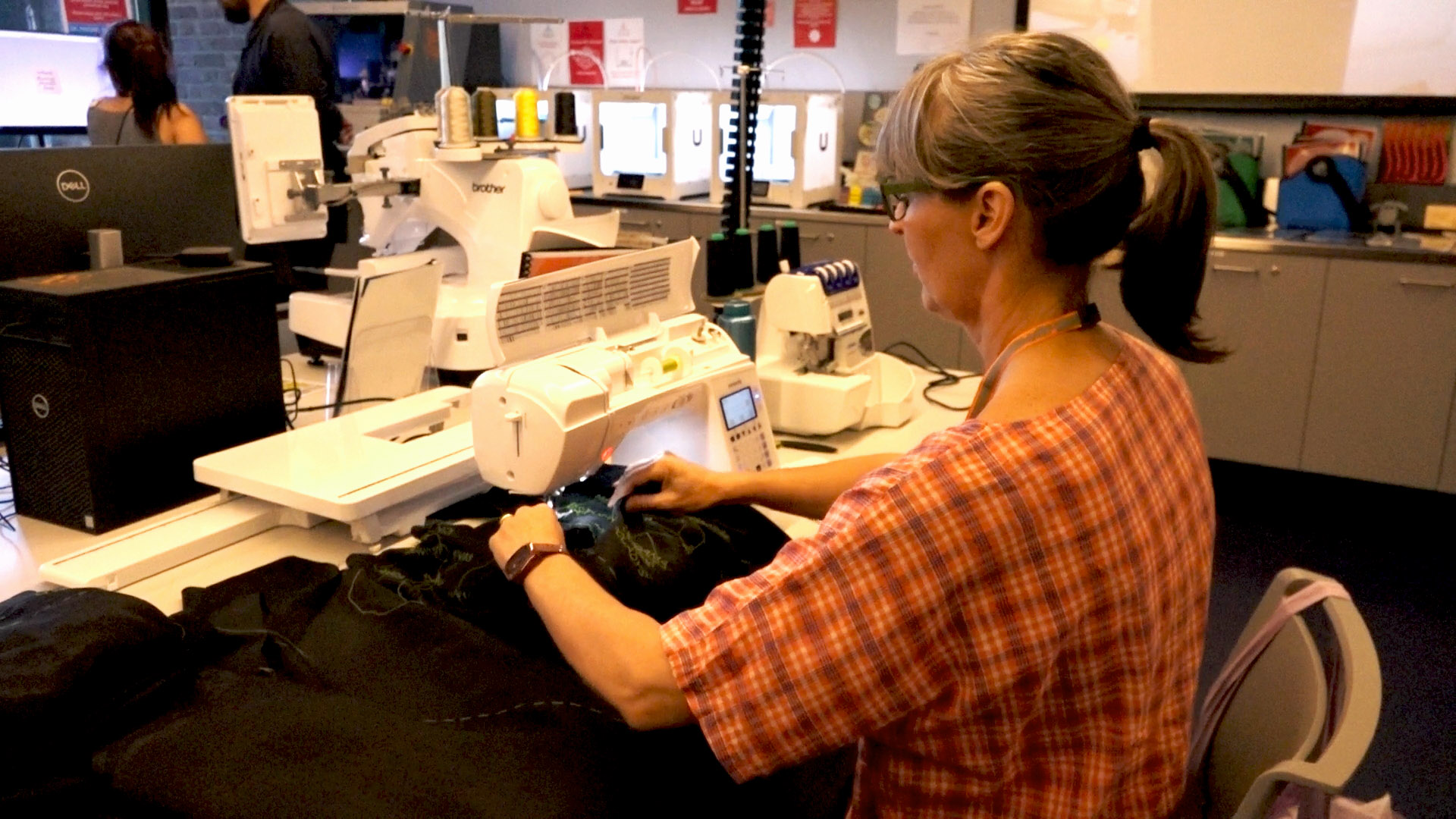 Creative in Residence Artist for 2025, Shannon Slee, sewing her memorial textile work