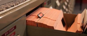 An open drawer holding microfilm records