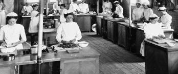 Black and white image of girls in kitchen 19th century