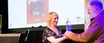John Burch accepting Victorian Premier's History Award John Burch accepts award from Catherine Andrews
