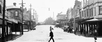 Black and white photo of a suburban street