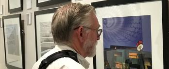 man look at Photo gallery 
