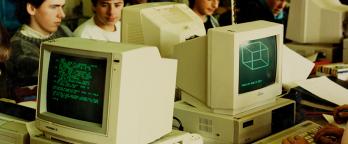 old fashioned computers being used by school children