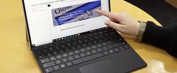New e-learning a person's hand on the computer