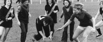 women playing football