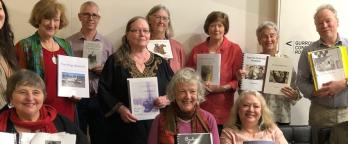 photo of students from last year's writing class holding up their finished books photo of students from last year's writing class holding up their finished books
