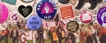 Collection of badges from the Australian Queer Archives