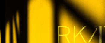 yellow and black shapes with RKAT logo