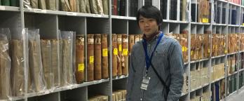 Yoshiyuki Shibuya photo of a student standing in the archives repository