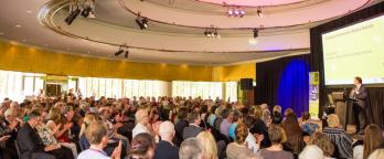 Photo of the arts centre filled with an audience