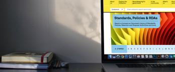 Edited Stock Image laptop with document library on screen