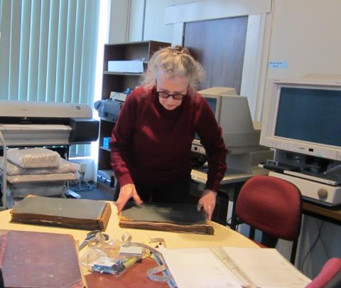 a woman working with books