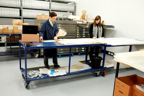 two people working at a standing desk