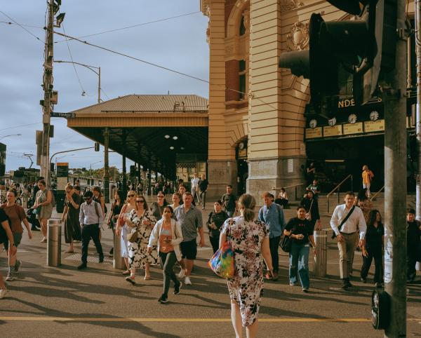 people crossing the road at Flinders street station