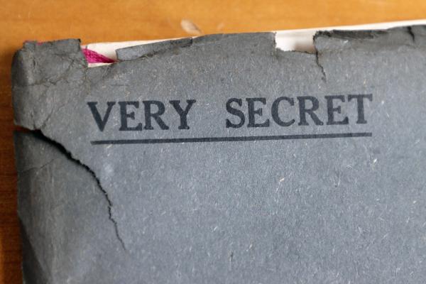 the corner of a file that says 'very secret'