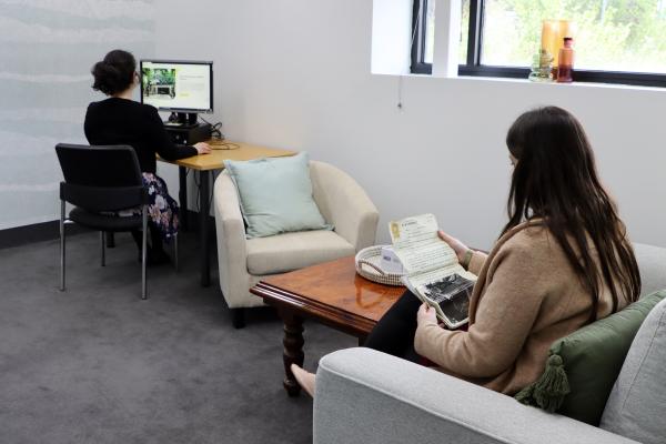 two people researching in a private room