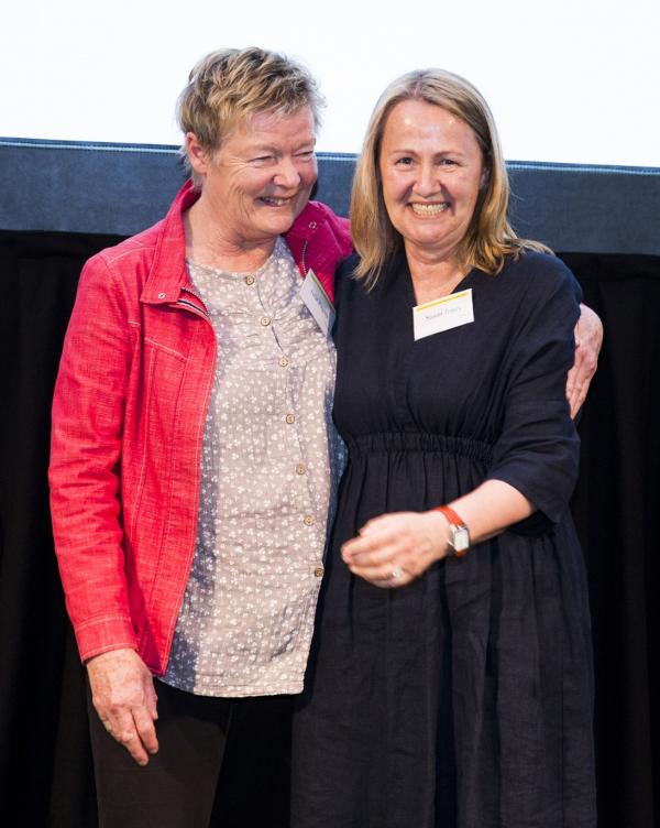 two people smiling