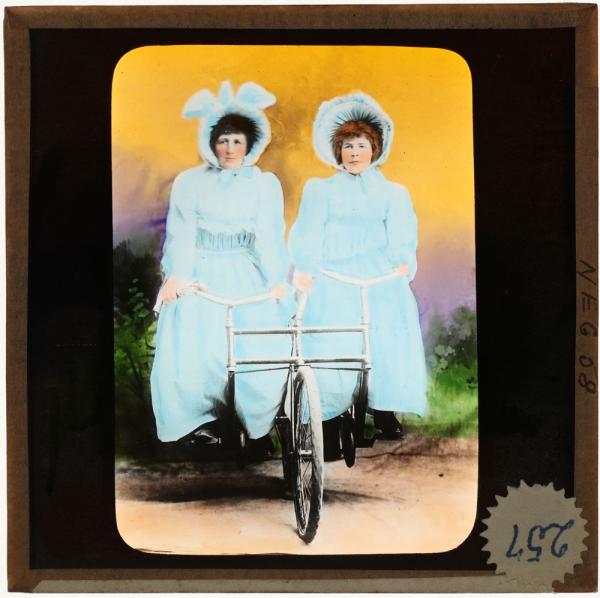 two girls on a double bike