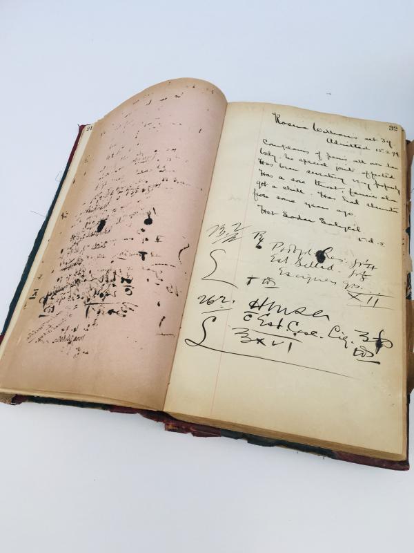 an open book with handwritten notes