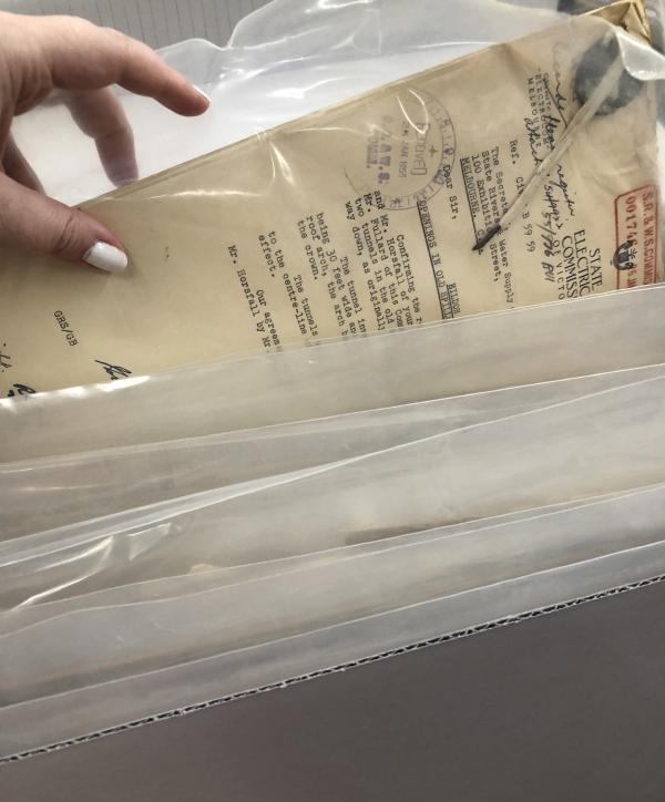 hands in a box of files
