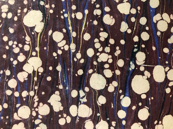 water coloured swirls on a piece of paper