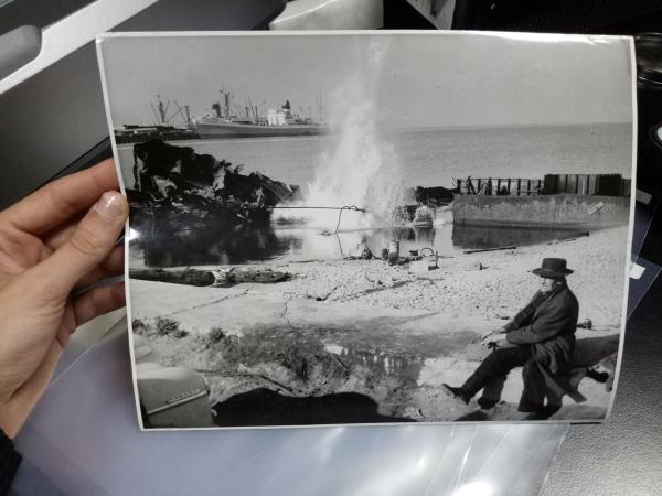 holding a photo