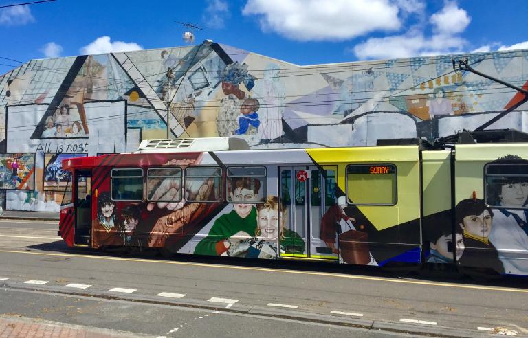 Women's Mural Art Tram in front of the Women's Mural